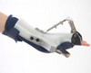 An orthotic brace to treat wrist drop and provide finger therapy and muscle rehabilitation.